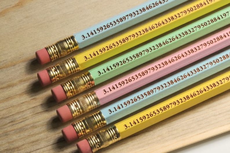 May include: A collection of colorful pencils with the mathematical constant Pi printed on them. Each pencil is a different pastel color, including blue, yellow, green, and pink. The pencils have pink erasers and gold-colored metal bands.