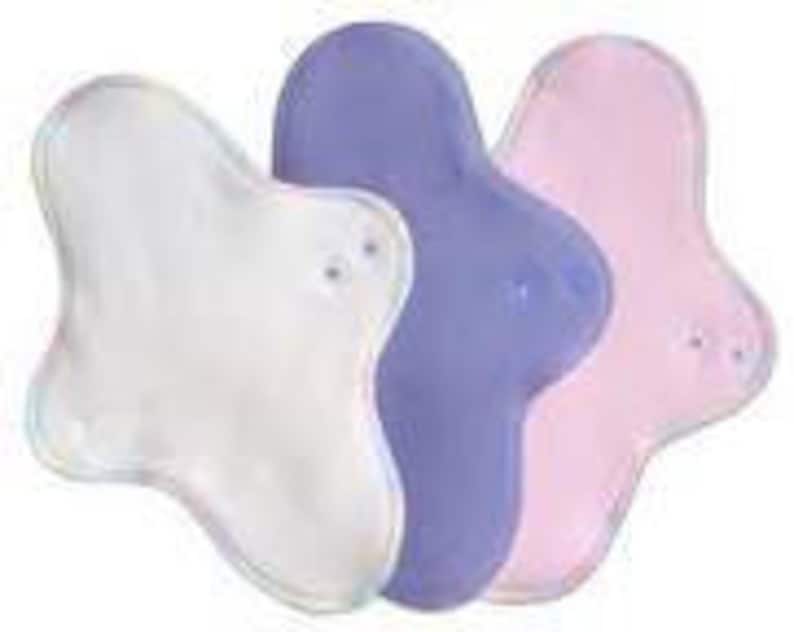 May include: Three reusable cloth menstrual pads in white, purple, and pink.