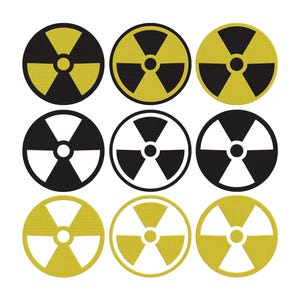 May include: Nine circular radiation symbols in a grid pattern. The symbols alternate between black and yellow, and black and white. Each symbol features a central dot with three radiating blades, a common warning sign.