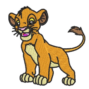 May include: Embroidered lion cub image in orange, tan, and black. The cub has a smiling expression with a pink nose and mouth. The design features detailed stitching, giving it a textured appearance. The cub is standing with its tail curled.