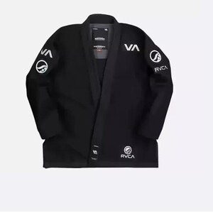 May include: Black martial arts uniform with white logos. The jacket features the letters "VA" on the chest and sleeves, along with the brand name "RVCA". The uniform is laid flat on a white background.