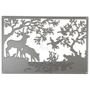 May include: Metal die cut for crafting featuring a silhouette of two deer standing by a lake with trees and branches in the background.