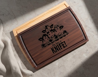Cutting board: Funny Cow He Has a Knife Cutting Laser Engraved Board