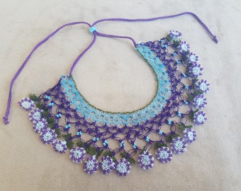 Bib necklace with blue and purple flowers