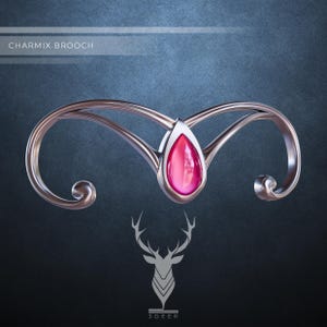 Puede incluir: Un broche de plata con una piedra preciosa rosa en forma de lágrima. El broche está diseñado con dos líneas curvas que se unen en la parte superior, creando un aspecto delicado y elegante.