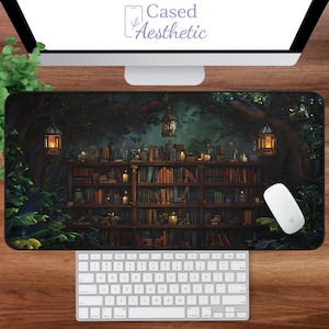 May include: A large rectangular mousepad featuring a detailed illustration of a library with bookshelves, candles, and lanterns. The background shows a forest scene. The text "Cased Aesthetic" is visible at the top.