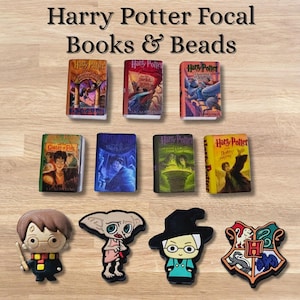 May include: A collection of Harry Potter-themed focal beads and miniature book charms. The books feature colorful covers with titles like "Harry Potter" and "Goblet of Fire." Character beads include Harry Potter, Dobby, and a Hogwarts crest.