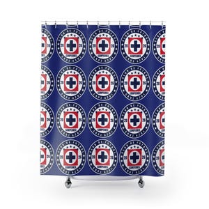 May include: A dark blue shower curtain featuring a repeating pattern of the Club de Futbol Cruz Azul logo. Each circular emblem displays a red square with a dark blue cross, the text CAMPEONES, the numbers 20 and 26, and three stars above.