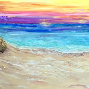 Sunset on the ocean, deserted beach at sunset
