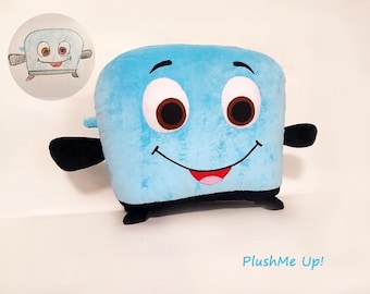 May include: A large, plush, light blue toaster-shaped toy with a smiling face, large brown eyes, and black arms and feet. A smaller, circular drawing of the toaster is in the upper left corner. The text "PlushMe Up!" is at the bottom.