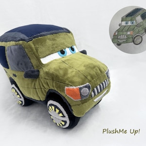 May include: A plush toy car in olive green, navy blue, and gray. The toy car has large blue eyes, white headlights, and black and yellow wheels. A drawing of the car is in the upper right corner. The text "PlushMe Up!" is at the bottom.