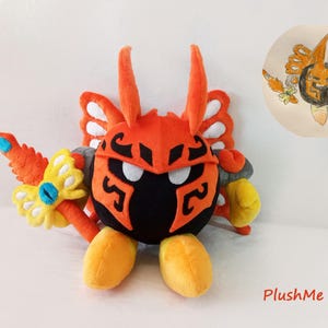 May include: A plush toy character with an orange and black helmet, wings, and a weapon. The toy has yellow feet and a yellow and blue flower-like accessory. The text "PlushMe Up!" is in the bottom right corner.