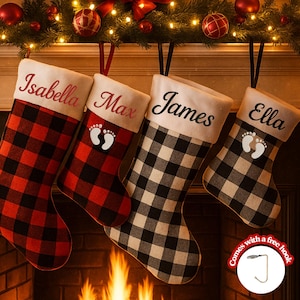 May include: Four Christmas stockings with personalized names: Isabella, Max, James, and Ella. The stockings feature a buffalo plaid pattern in red and black, and black and white. Each stocking has a white cuff with the name embroidered in a complementary color. A free hook is included.