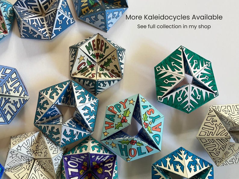 May include: A collection of paper kaleidocycles featuring various holiday designs, including snowflake patterns and text reading Merry Christmas and Happy Holidays. The geometric shapes are colored in shades of blue, green, and white, with some uncolored outlines.