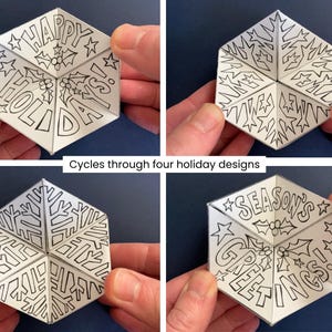 May include: A white hexagonal paper toy with black line art that cycles through four holiday designs. The panels feature text reading HAPPY HOLIDAYS! and SEASON'S GREETINGS, alongside illustrations of holly berries, leaves, and stars.