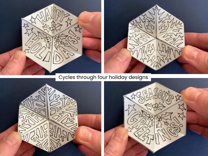 May include: A white hexagonal paper toy with black line art that cycles through four holiday designs. The panels feature text reading HAPPY HOLIDAYS! and SEASON'S GREETINGS, alongside illustrations of holly berries, leaves, and stars.