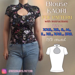 May include: A black short-sleeve blouse with a floral print, featuring a mandarin collar and a teardrop-shaped cutout at the chest. Text reads: Blouse KAORI PDF PATTERN with instructions, Sizes: XXS, XS, S, M, L, XL, XXL, 3XL, 15% stretch.