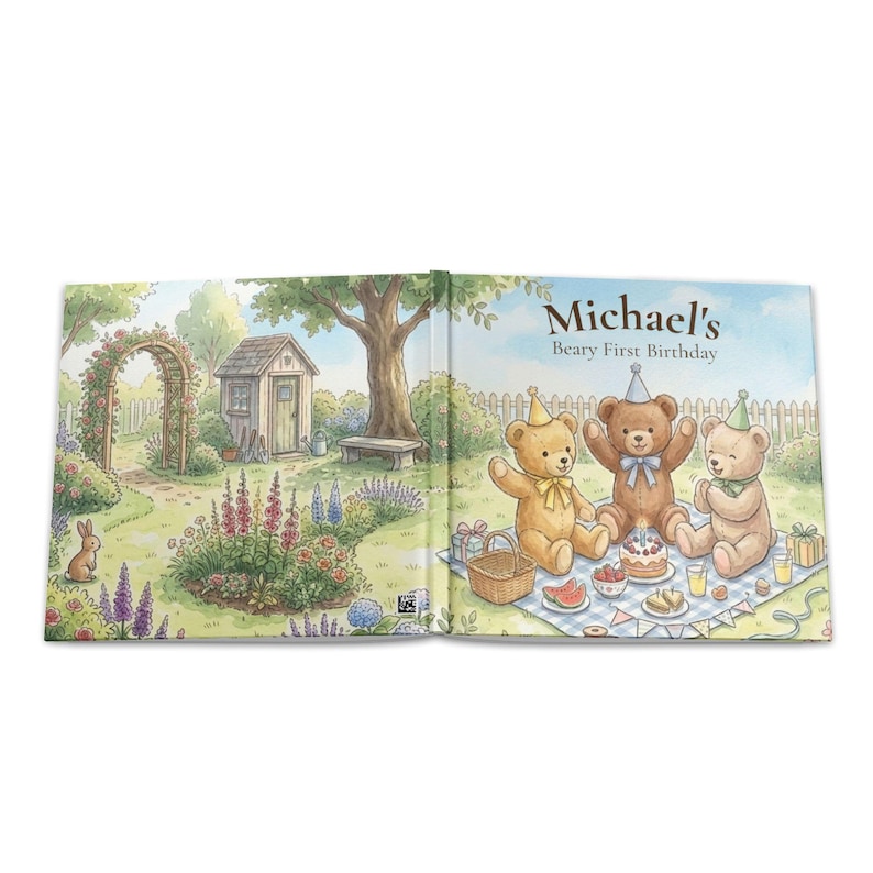 May include: An open children's book featuring a watercolor illustration of a garden scene on the left and three teddy bears having a birthday picnic on the right. The text reads Michael's Beary First Birthday above the bears on a blue sky.