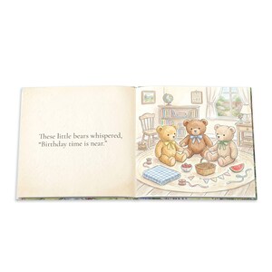 May include: An open children's book with text on the left page reading, "These little bears whispered, "Birthday time is near."" The right page features an illustration of three teddy bears sitting on a rug with a picnic basket and watermelon.