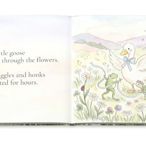May include: A children's book illustration featuring a white goose with a blue bow, a green frog, and a turtle in a field of flowers. The text reads, "That little goose twirled through the flowers. With giggles and honks that lasted for hours."