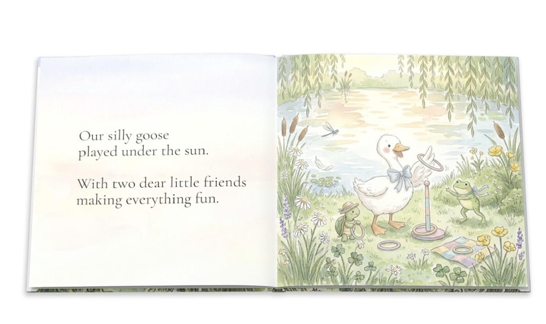 May include: A children's book illustration featuring a white goose with a blue bow tie playing a ring toss game with a frog and a turtle. The text reads: "Our silly goose played under the sun. With two dear little friends making everything fun."
