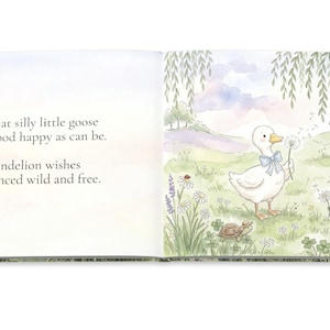 May include: A children's book illustration featuring a white goose with a blue bow, holding a dandelion. The scene is set in a meadow with a frog, turtle, and flowers. Text on the left page reads: "That silly little goose stood happy as can be. Dandelion wishes danced wild and free."