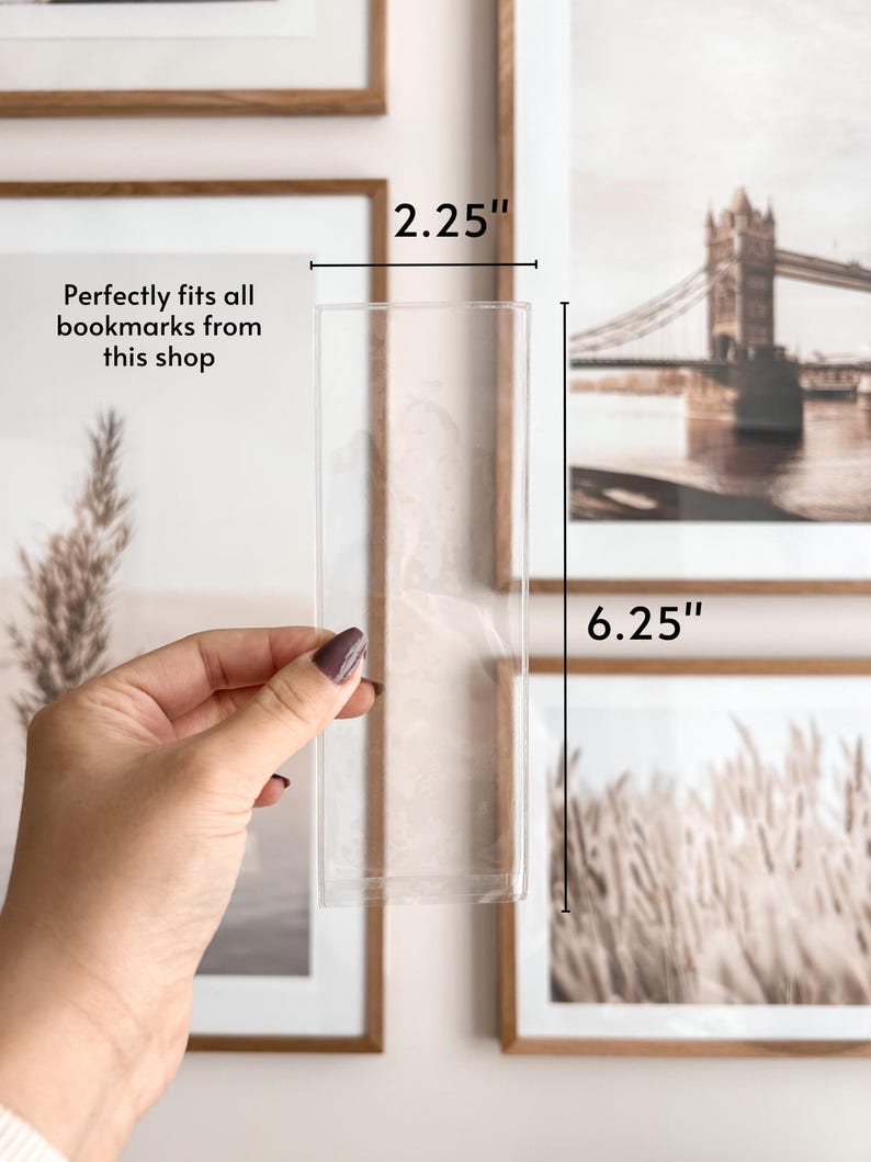 May include: A clear acrylic bookmark holder, 6.25 inches tall and 2.25 inches wide.  The holder is designed to fit all bookmarks from this shop.