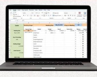 May include: A laptop displaying a spreadsheet titled "Wedding Budget." The spreadsheet includes columns for expense type, details, budget, actual, and pending date. The laptop is open on a white surface.