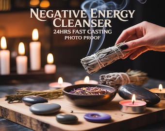 May include: A sage bundle held by a hand, emitting smoke, with the text "NEGATIVE ENERGY CLEANSER 24HRS FAST CASTING PHOTO PROOF." The image includes lit candles, a bowl of herbs, and smooth stones on a wooden surface, suggesting a spiritual theme.
