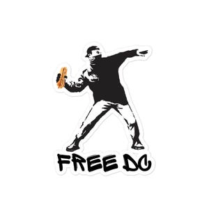 May include: A black and white sticker featuring a stencil-style image of a person throwing a hot dog. The person is wearing a hat and face covering. The words "FREE DO" are printed in bold, black letters at the bottom.
