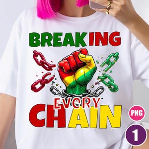 May include: White t-shirt with the words "BREAKING EVERY CHAIN" in green, red, and yellow. The design features a clenched fist in red, yellow, and green, breaking chains. The shirt has a round neck and short sleeves.