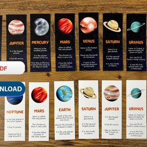 May include: A set of 10 colorful bookmarks featuring illustrations of the planets in our solar system. Each bookmark includes the name of the planet and a brief description of its key features. The bookmarks are printed on black cardstock with white text.