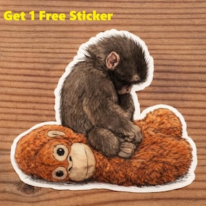 May include: A sticker featuring a detailed illustration of a baby orangutan sitting on a plush toy orangutan. The sticker has a white border and the text "Buy 5 Get 1 Free Sticker" in yellow.