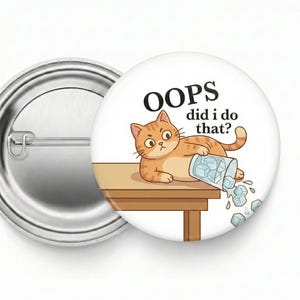 May include: A round button with a cartoon cat illustration. The orange tabby cat is lying on a brown table, with a spilled glass of ice cubes. The text reads "OOPS did I do that?"