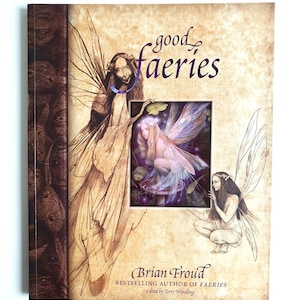May include: A book titled "good faeries" with illustrations of fairies. The cover features a central image of a fairy with purple and pink wings, surrounded by other fairy sketches. The author's name, Brian Froud, is printed at the bottom.