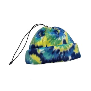 May include: A blue, green, and yellow tie-dye fleece hat with a drawstring.