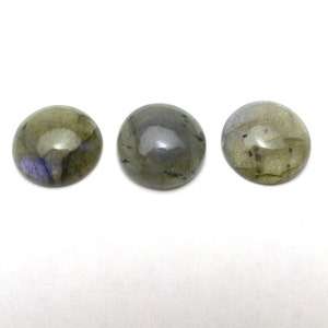 May include: Three round, smooth, green labradorite cabochons with iridescent blue and black flecks.