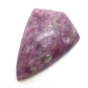 May include: A triangular shaped, purple and white lepidolite cabochon gemstone. The stone has a mottled appearance with a mix of light and dark purple hues.