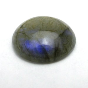 May include: A round, gray and blue labradorite gemstone cabochon with iridescent flashes.