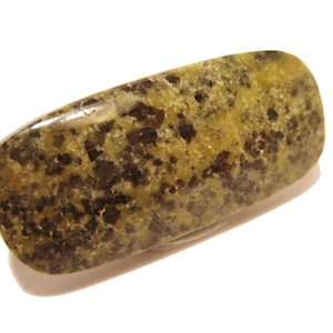 May include: A polished, rectangular stone with rounded edges. The stone features a mottled pattern of olive green and dark brown, with a glossy finish. The shape is elongated, and the stone appears to be a natural mineral specimen.