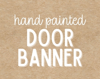 May include: A hand-painted door banner with white text on a tan background. The text reads "hand painted DOOR BANNER" in a playful font. The banner is likely for home decor.