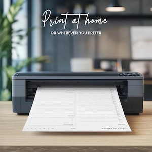 May include: A black and gray printer with a white sheet of paper coming out of it. The paper has the text "DAILY PLANNER" and "DATE" printed on it. The text "Print at home OR WHEREVER YOU PREFER" is printed above the printer.