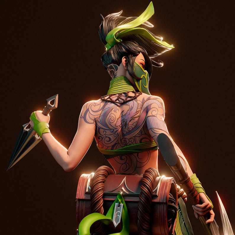 May include: A female figure with green and black clothing and a green and black mask, holding a black dagger in each hand. She has a large tattoo on her back and is wearing a green and black belt. She is standing in front of a brown chest with rope accents.