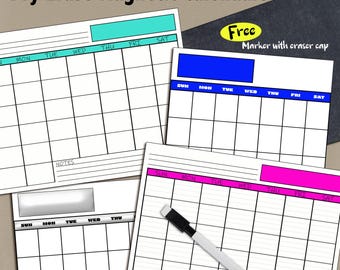 May include: White dry erase magnetic calendars with colorful headers. The calendars have a grid layout for daily planning, with space for notes. A free marker with an eraser cap is included. The text "Dry Erase Magnetic Calendars" is at the top.