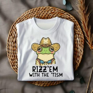 Rizz &#39;Em with the Tism Funny Frog Meme T-Shirt | Viral Rizz Shirt | Autism Humour Tee | Gift for Him & Her
