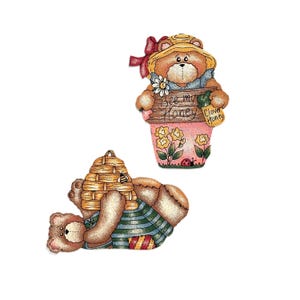 May include: Two whimsical bear figurines. One bear holds a sign that reads "Bee my Honey" and a "Clover Honey" tag. The other bear is lying down with a beehive on its back. Both bears are painted in soft colors with floral and bee accents.