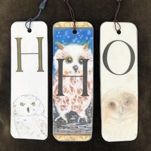 Whimsical owl bookmark trio featuring the letters O and H —printed on watercolour paper, laminated, and full of charm.