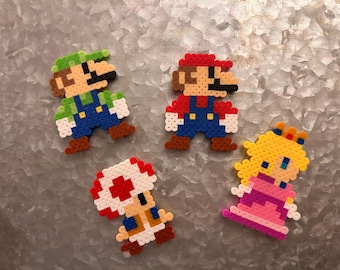 Mario, Luigi, Princess Peach, and Toadstool fridge magnets, set of 4