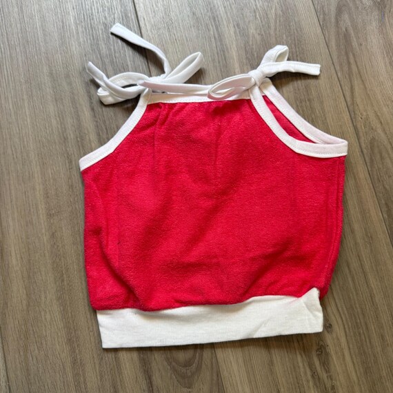 Pink Terry Cloth Tank That Ties on the Shoulders. Halter Top. New with Tags. Marked a 4-5 Years. Excellent condition.