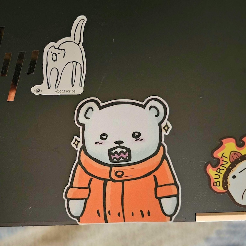 white bear sticker on laptop